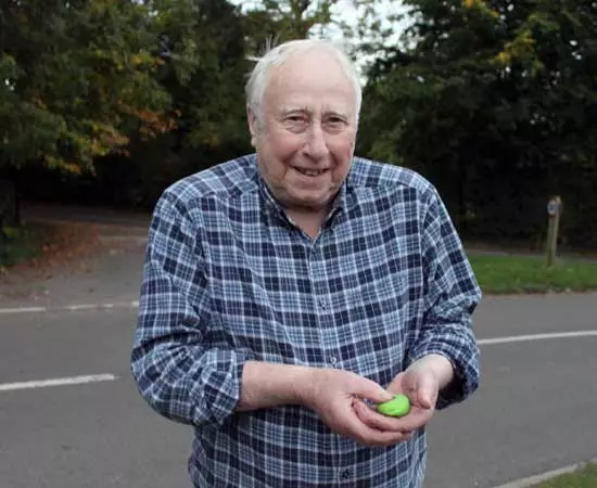 Doctor Alert pendant being held in hand
