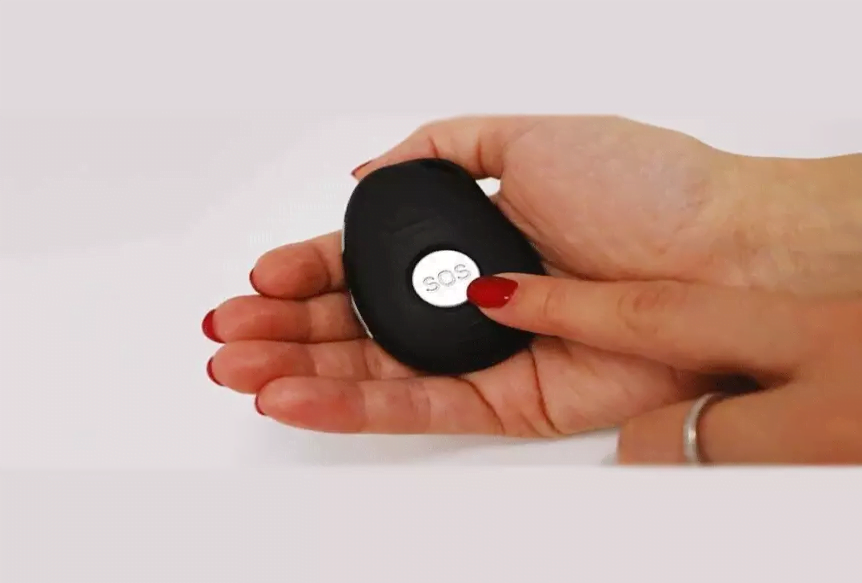Senior pressing the SOS button on a Doctor Alert pendant